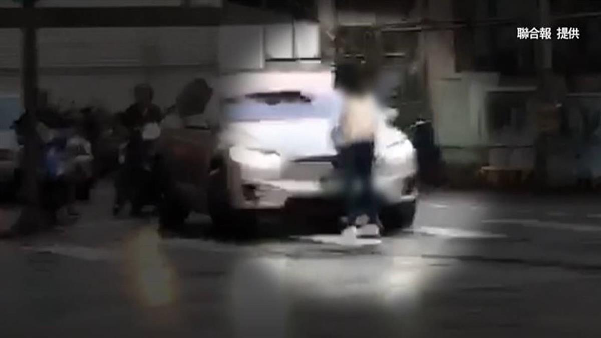 感情糾紛?女肉身擋紅綠燈口 百萬車狂按喇叭